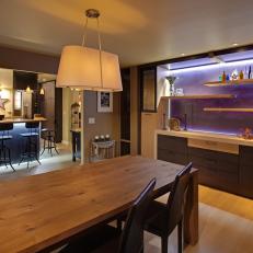 Contemporary Dining Room With Illuminated Accent Wall