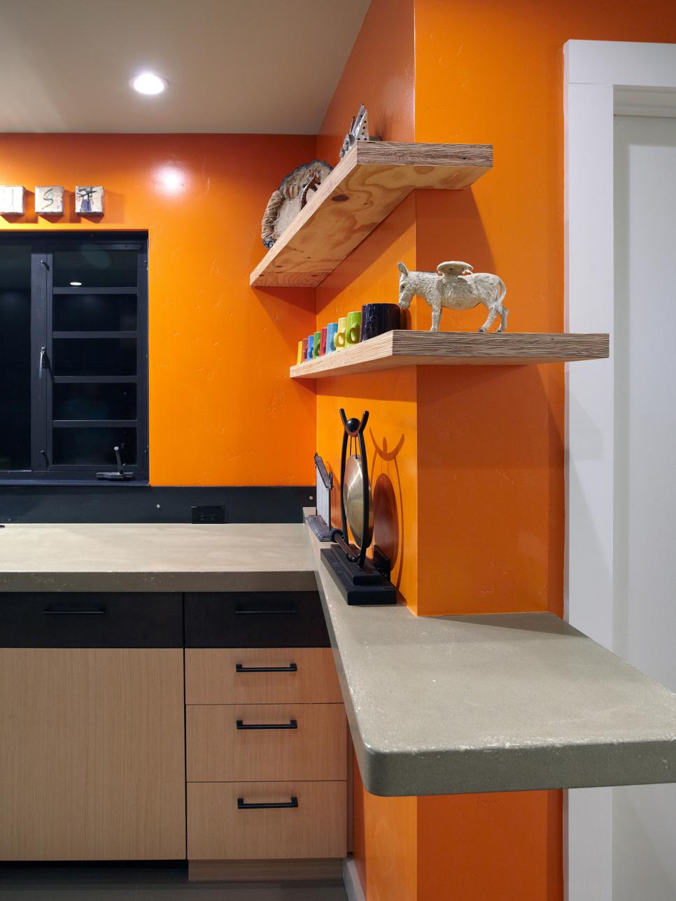 Bright Orange Kirchen With Concrete Countertops and Floating ...