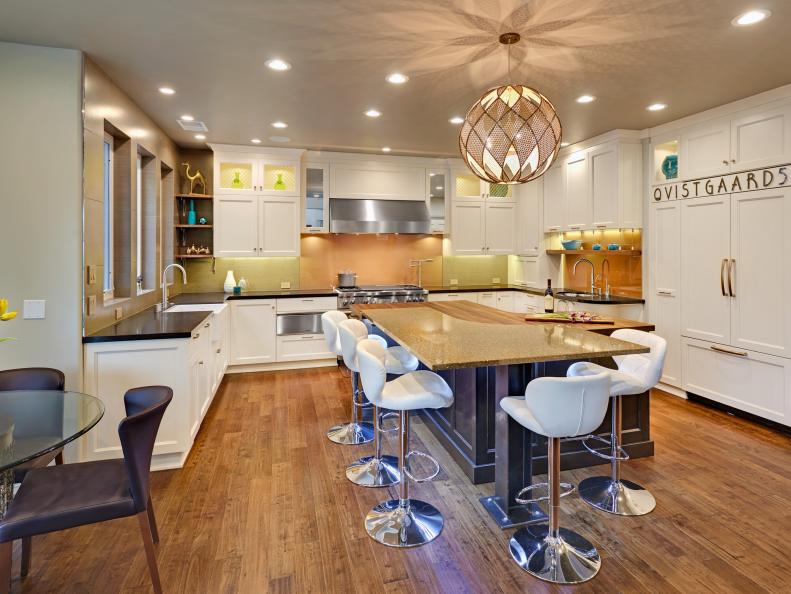 Transitional Kitchen With White Shaker Cabinets and Modern Island Bar