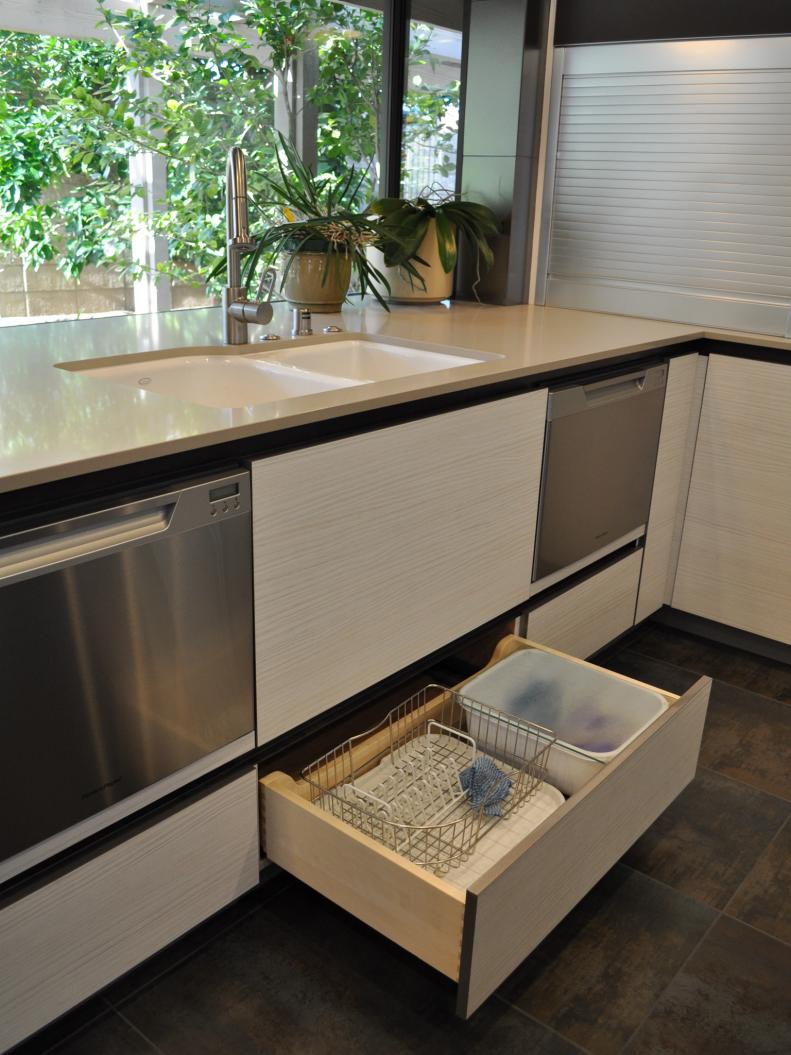White Modern Kitchen With Storage Drawer Below Sink
