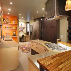 Concrete and Zebrawood Countertops in Eclectic Orange Kitchen