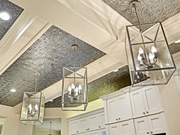 Silver Tin Ceiling with Lantern Pendant Lighting in White Kitchen