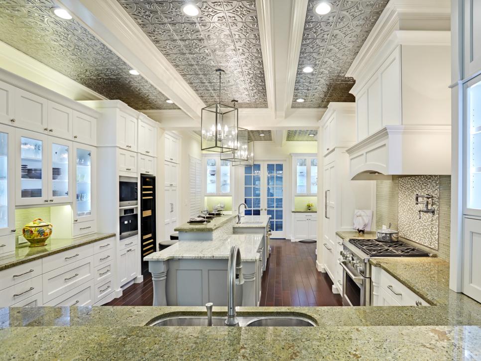 White Gourmet Kitchen With Large Island