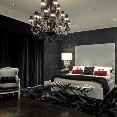 Black Bedroom With Damask Wallpaper and Black Chandelier