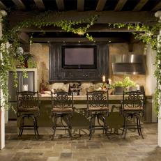 Mediterranean Outdoor Bar and Kitchen with Built-In Television