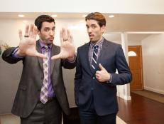 As seen on HGTV's Brother vs. Brother, hosts Drew (left) and Jonathan Scott pose for a portrait in the Bartholomew home in Northridge, California, after the panel finished their evaluation of Team Jonathan's renovation. (Portrait)