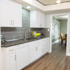 Gray and White Galley Kitchen With Vinyl Floors