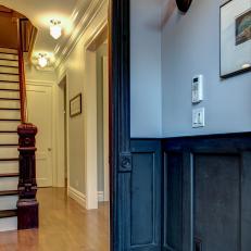 Masculine Foyer with Dark Color Scheme and Faux Taxidermy