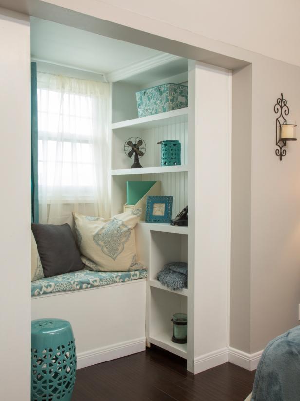 Built-In Window Seat With Open Shelves and Blue Accessories