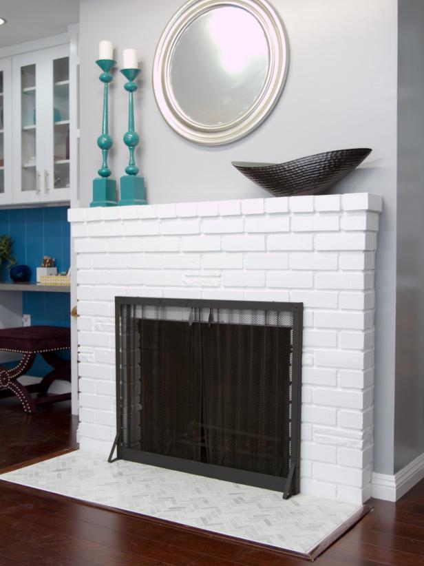 White Painted Brick Fireplace With Herringbone Tile Hearth | HGTV
