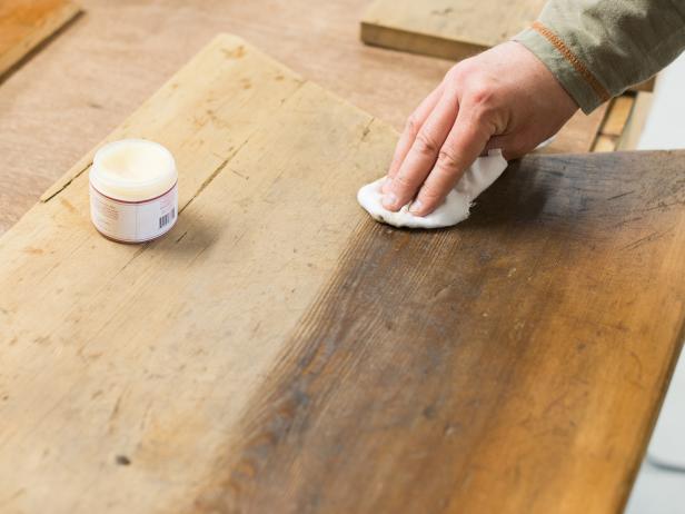 Clean board with cotton cloth and mineral spirits to remove any old residue and dust and allow board to completely dry. With another clean, lint-free cloth, apply food-safe beeswax wood finish to all surfaces of the board, working wax deep into the wood grain.