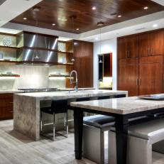Luxury Kitchen With Mahogany Detail and Waterfall Countertop