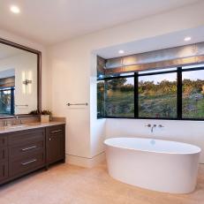 Spacious Bathroom With Freestanding Bathtub and a View