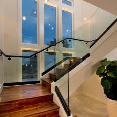 Ultra-Modern Wood Staircase Boasts Transparent Glass Banisters