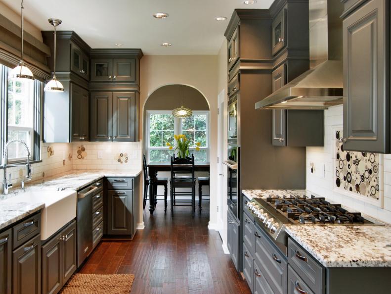 Transitional White Kitchen With Gray Cabinetry and Granite Countertops