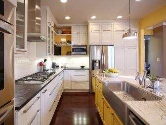 Yellow and White Kitchen With Stainless Steel Farmhouse Sink
