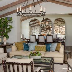 Neutral Mediterranean-Style Living Room With Vaulted Ceiling