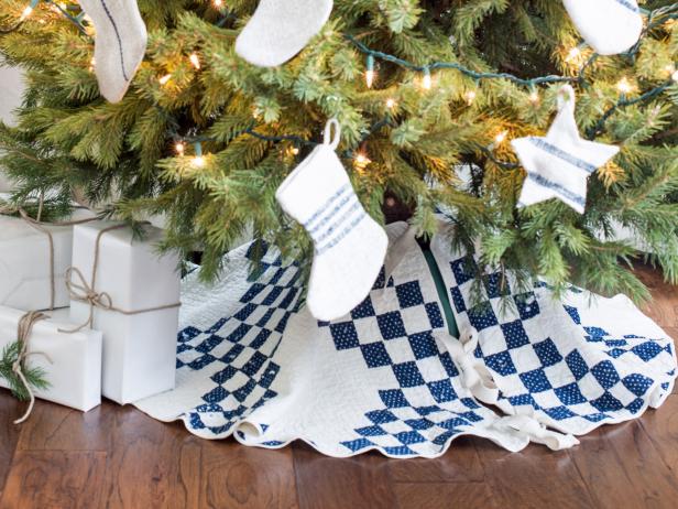 Some old quilts are too fragile or tattered to use as bedding, but they're too precious to throw away. Repurpose one into a charming, cottage-style Christmas tree skirt by using the largest intact portion of the quilt.