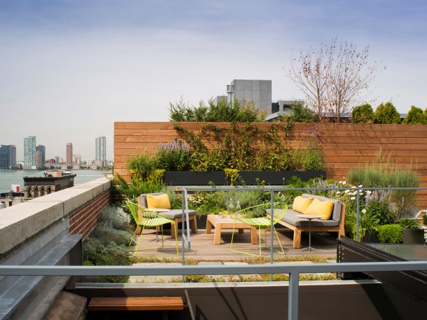 Deck With Wood Privacy Wall, Small Garden and Contemporary Furniture