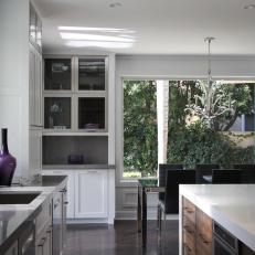 Stainless Steel Cabinet Frames Infuse Modern Style Into Traditional Kitchen
