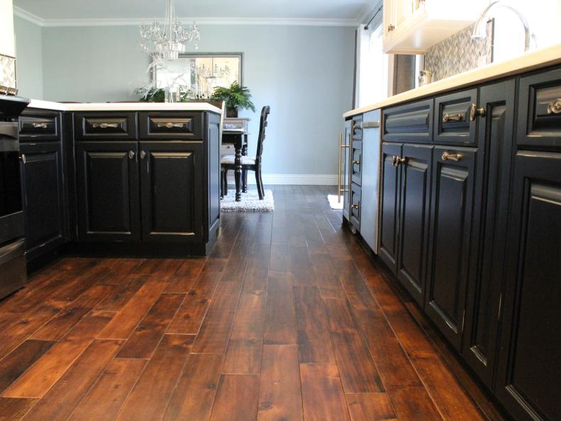 Brown Walnut Floors in Kitchen with Black Lower Cabinets