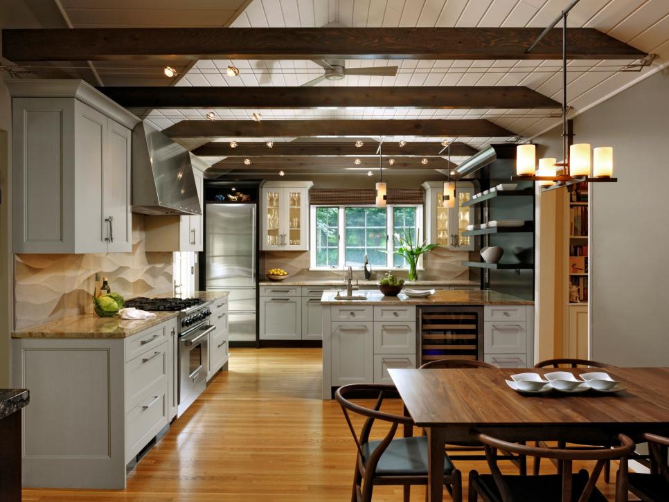 Eat-In Kitchen With Shaker-Style Cabinets and Exposed Ceiling Beams