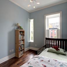 Simple, Transitional Boy's Bedroom With Classic Blue Walls