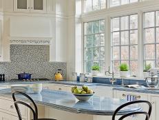 Kitchen With White Wood Cabinets and Blue Stone Countertop
