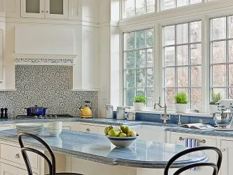 Kitchen With White Wood Cabinets and Blue Stone Countertop