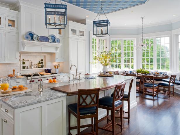 Kitchen With Contrasting Counters and Blue Lantern Lights