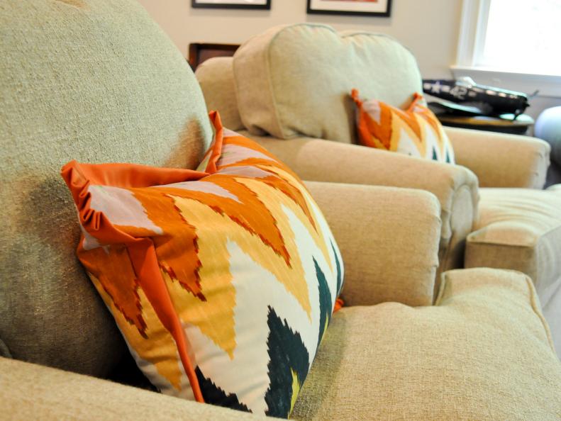 Orange Chevron Pillow in Neutral Chair