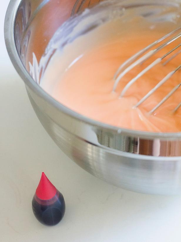 To turn the pudding orange, add 5 drops of red food coloring and mix well.