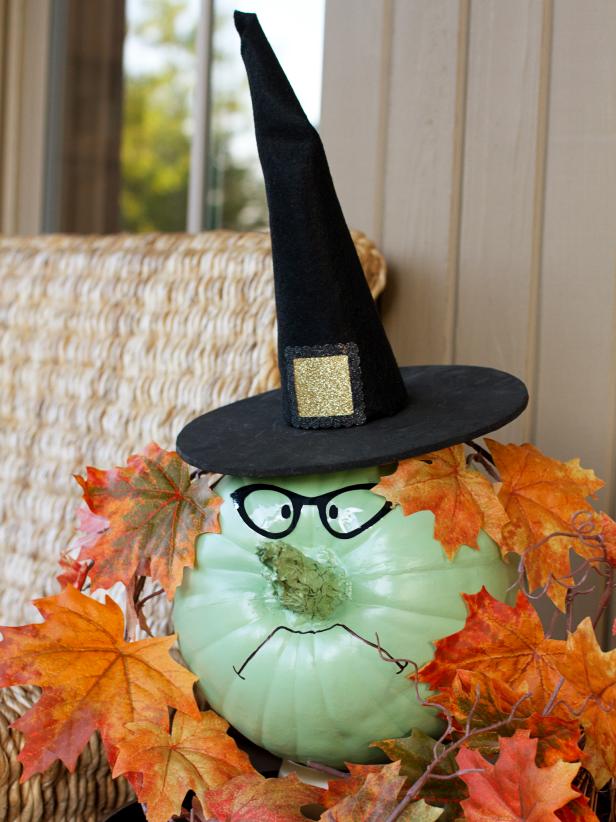 Painted pumpkin with witch features