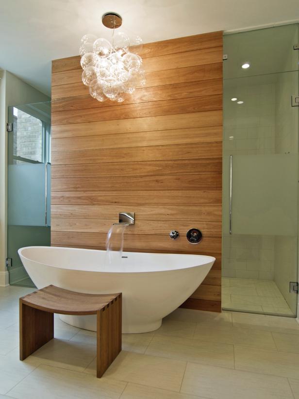 Contemporary Bathroom With Cedar Wall, Freestanding Tub and Chandelier