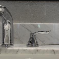 White Marble Sink and Contemporary Chrome Faucet