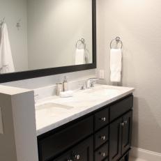 Contemporary Bathroom With Black Double Vanity and Mirror
