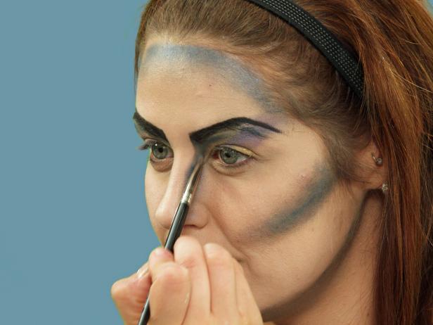 With a small makeup brush, blend the inside of the brow down to the top of the nose.