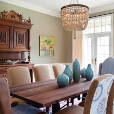 Transitional Green Dining Room With Chandelier