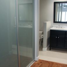 Gray Transitional Bathroom With Frosted Closet Doors