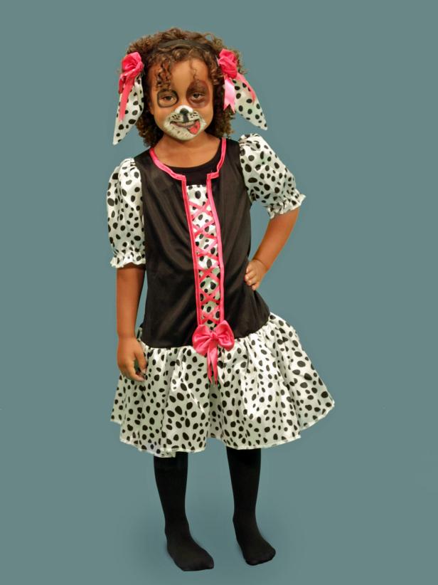 To complete a puppy look for Halloween, pull the puppy's hair into high pigtails to resemble fluffy ears or glue some fabric ears onto a headband. You can use a store-bought costume or a brown sweat suit with spots drawn on with a marker for a quick DIY costume.
