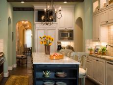 Mint Green Traditional Kitchen With Marble Island and Iron Chandelier