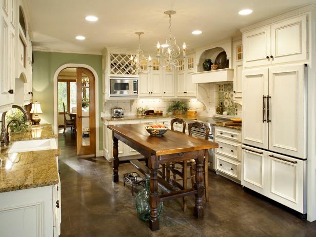 Off-white French Country kitchen with unique kitchen island. 