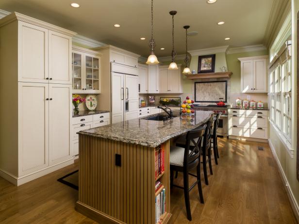 Eat-In Kitchen With White Cabinets, Large Island and Concealed Fridge