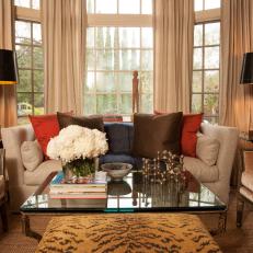 Traditional Sitting Area With Contemporary Tiger-Print Ottoman