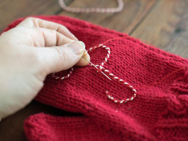 At the end of letter, trim excess twine and secure the end with several stitches to prevent fraying.