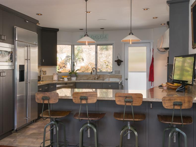 Contemporary Kitchen With Barstools and Stainless Steel Appliances