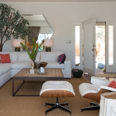Sleek White Sectional Sofa and Eames Lounge Chair