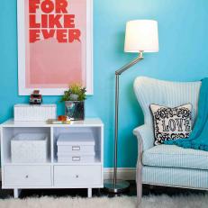 Turquoise Sitting Area With Blue Wingback Chair