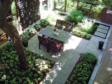 Courtyard With Wood Dining Set, Shade Tree and Bluestone Walkway