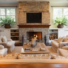 Transitional Neutral Living Room With Rustic Accents and Stone Fireplace